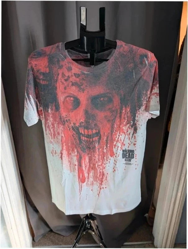 AMC The Walking Dead red and white graphic t-shirt featuring bold zombie face print.