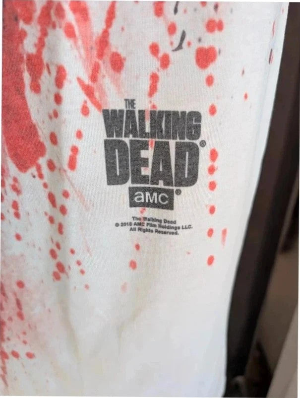 AMC The Walking Dead red and white graphic t-shirt featuring bold zombie face print.