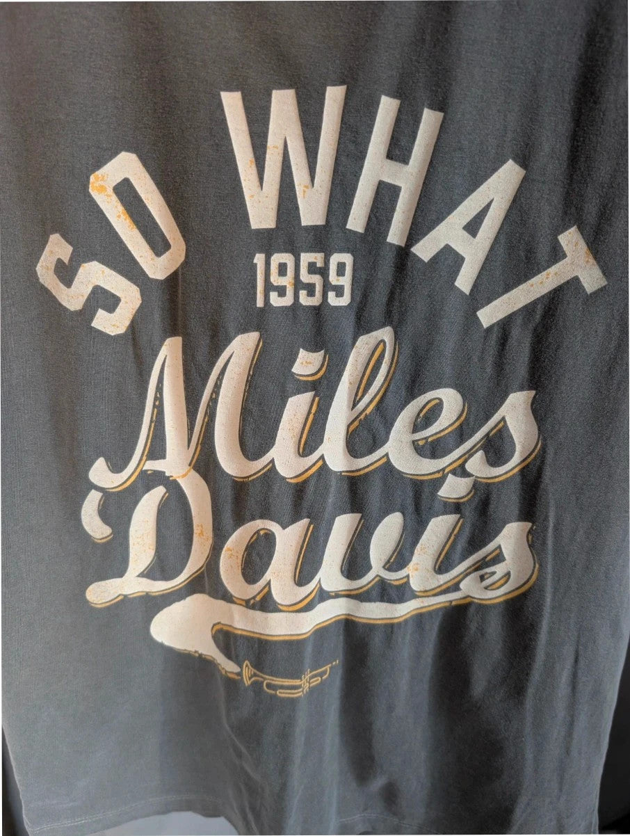 Miles Davis grey graphic t-shirt with "So What 1959" typography and trumpet artwork.