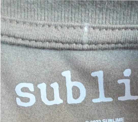 Sublime khaki graphic t-shirt featuring distressed sun artwork and bold red logo print.