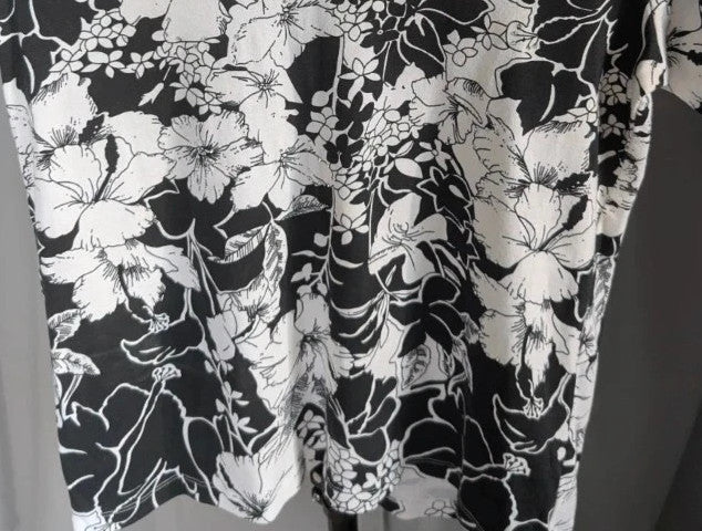ISLE black white floral graphic t-shirt with rhinestone accents and hibiscus pattern.