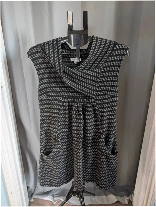 Apricot black and grey knit tunic dress with cowl neck and geometric pattern.