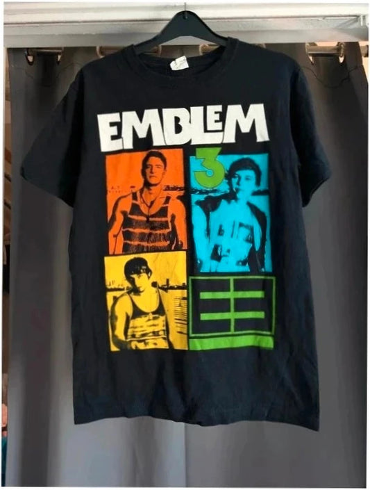 Emblem3 black graphic t-shirt with colorful four-panel print and ribbed crew neck.