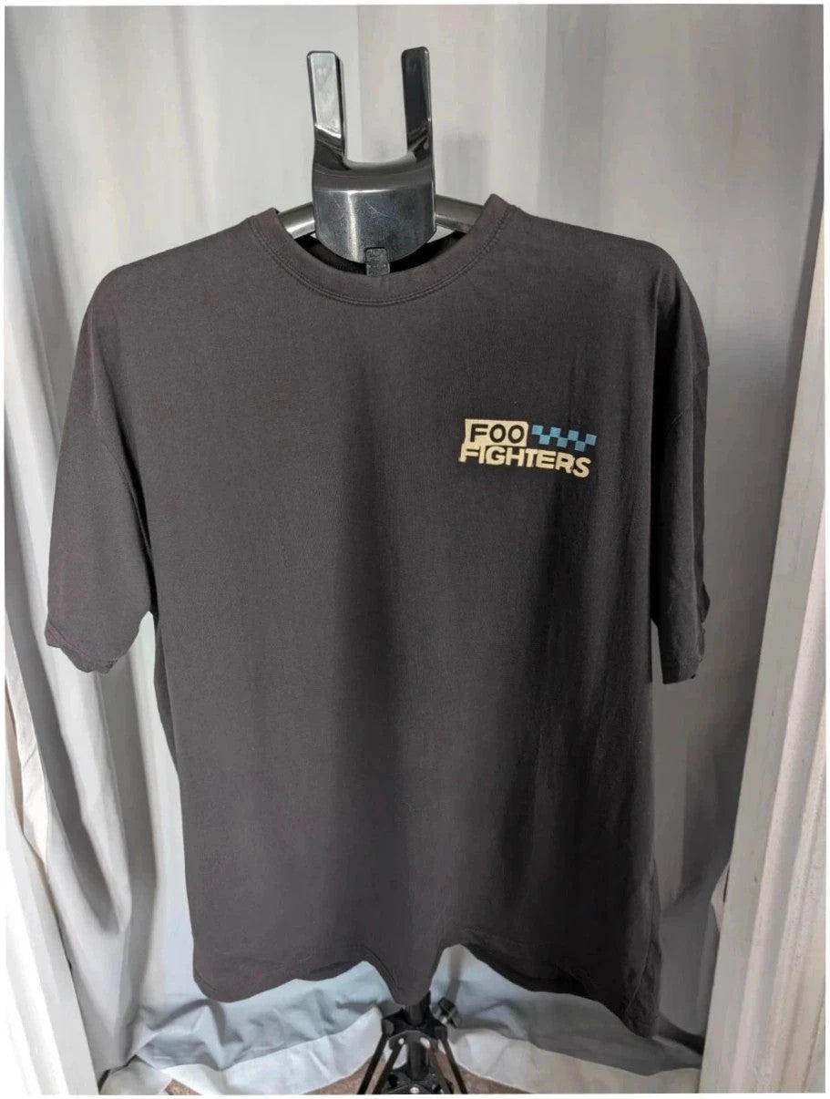Foo Fighters black graphic tee featuring coiling snake design and blue checkerboard pattern.