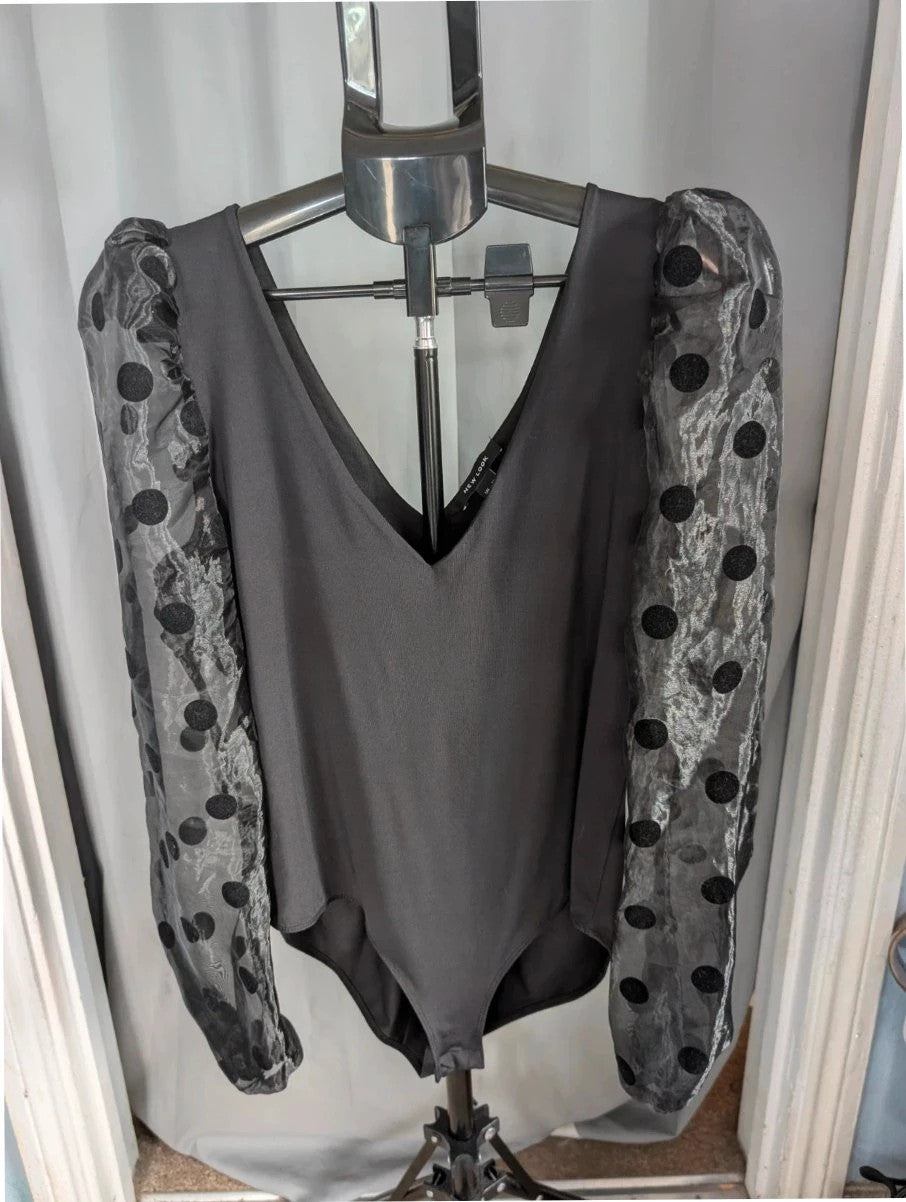 New Look black bodysuit with mesh polka dot sleeves and plunge V-neckline.