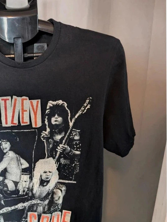 Mötley Crüe black graphic tee featuring retro collage artwork and red block logo.