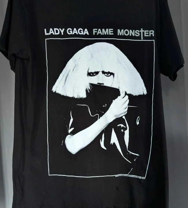 Lady Gaga black graphic t-shirt with white 'Fame Monster' print and crew neck.