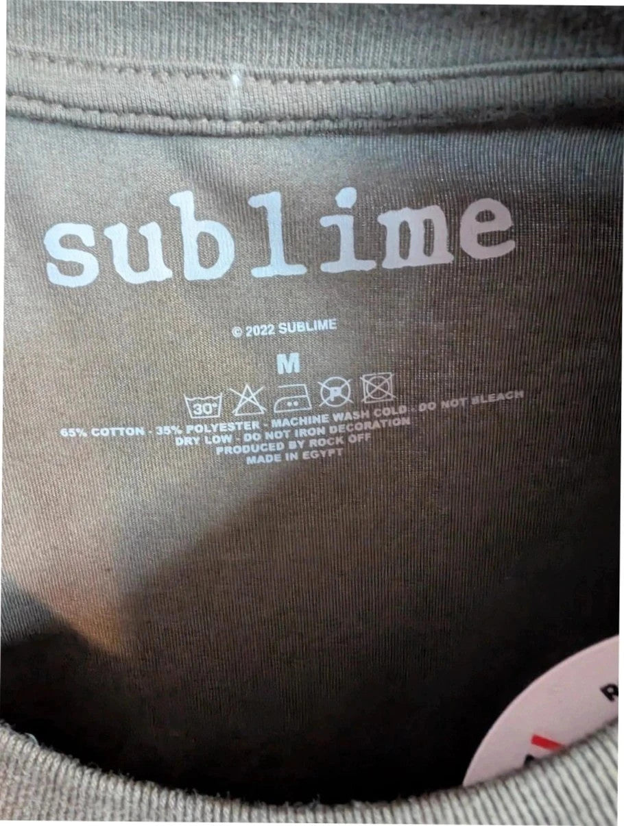 Sublime khaki graphic tee featuring distressed sun artwork and bold red gothic font.