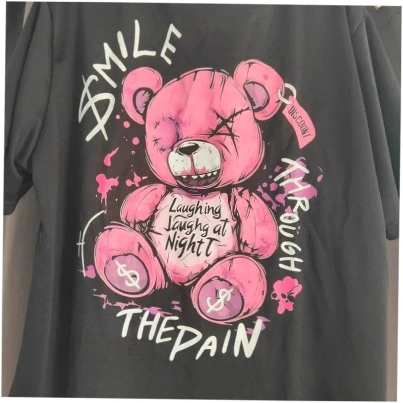Unbranded black graphic t-shirt with neon pink teddy bear and bold text design.